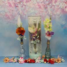 message bottles with floral bouquets